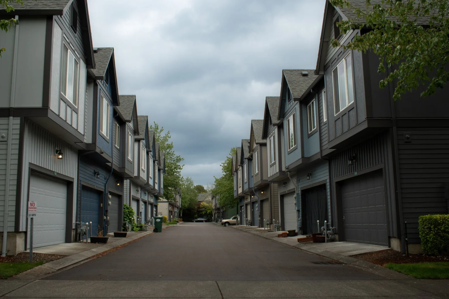 Townhome street with a coordinated grey and blue exterior colour scheme
